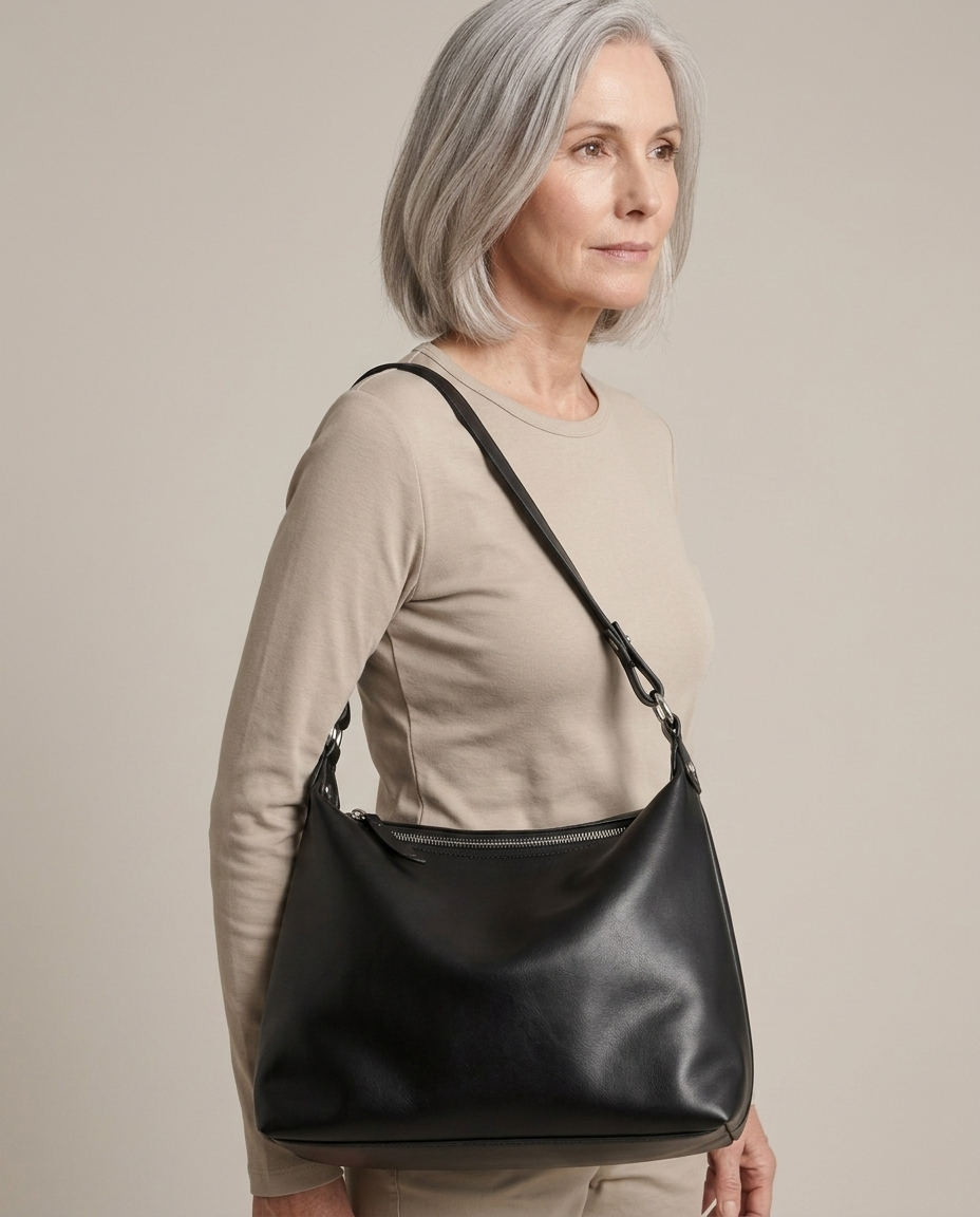 Black Faux Leather Convertible Shoulder Bag worn by a model, close waist-up view
