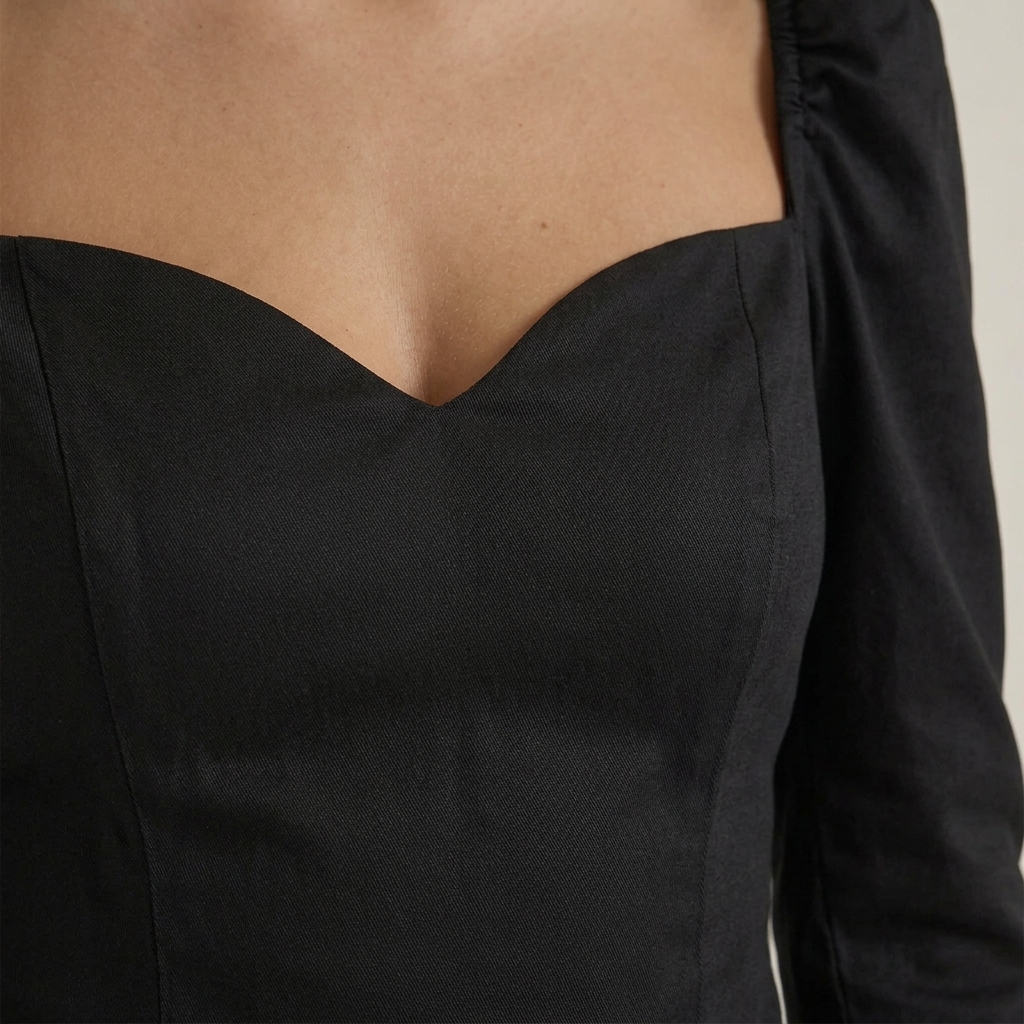Close-up of Black Sweetheart Puff Sleeve Top fabric and detailing