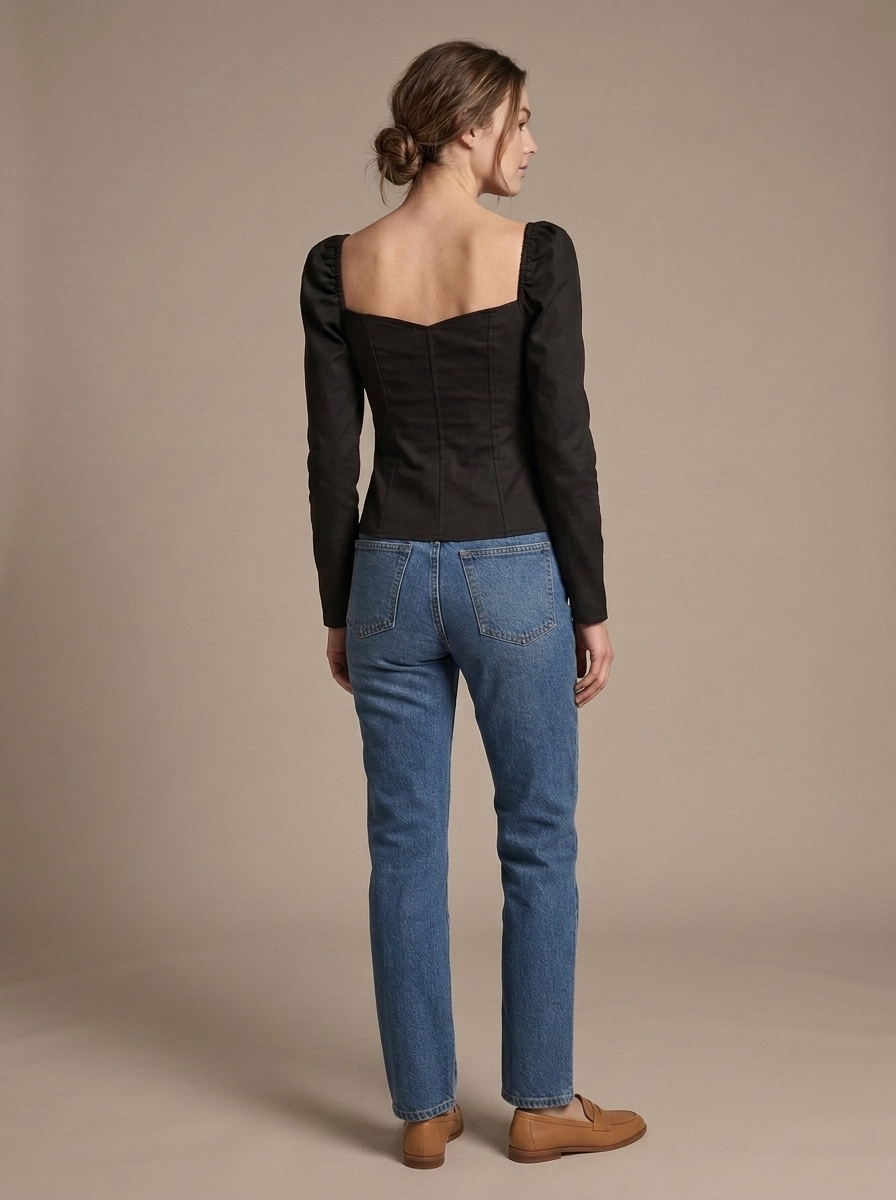 Black Sweetheart Puff Sleeve Top worn by a model, back view
