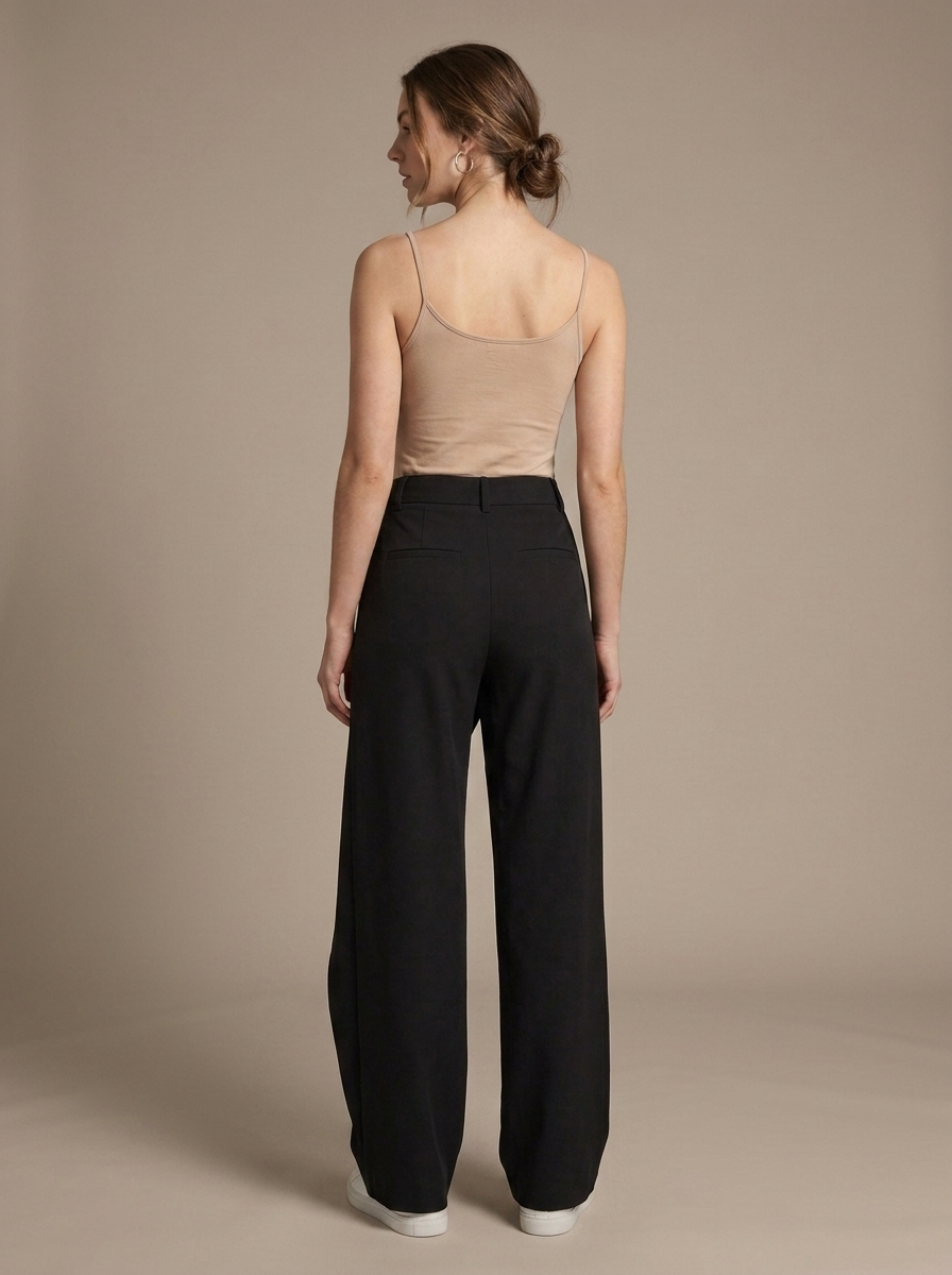 Black Wide-Leg Asymmetric Wrap Trousers worn by a model, back view
