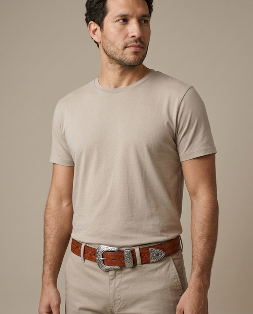 Leather Embossed Western Belt, Ornate Silver Buckle worn by a model, close waist-up view