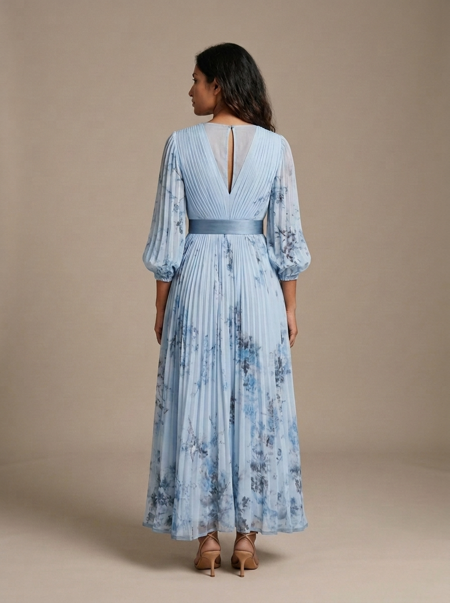 Pleated Maxi Dress Blue Floral V-Neck Long Sleeve worn by a model, back view