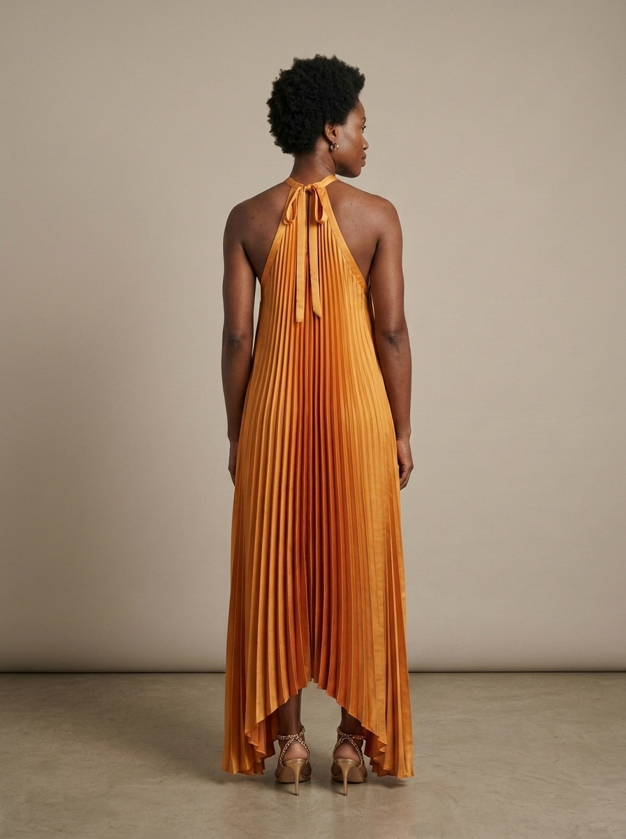 Saffron Pleated Halter High-Low Maxi Dress worn by a model, back view