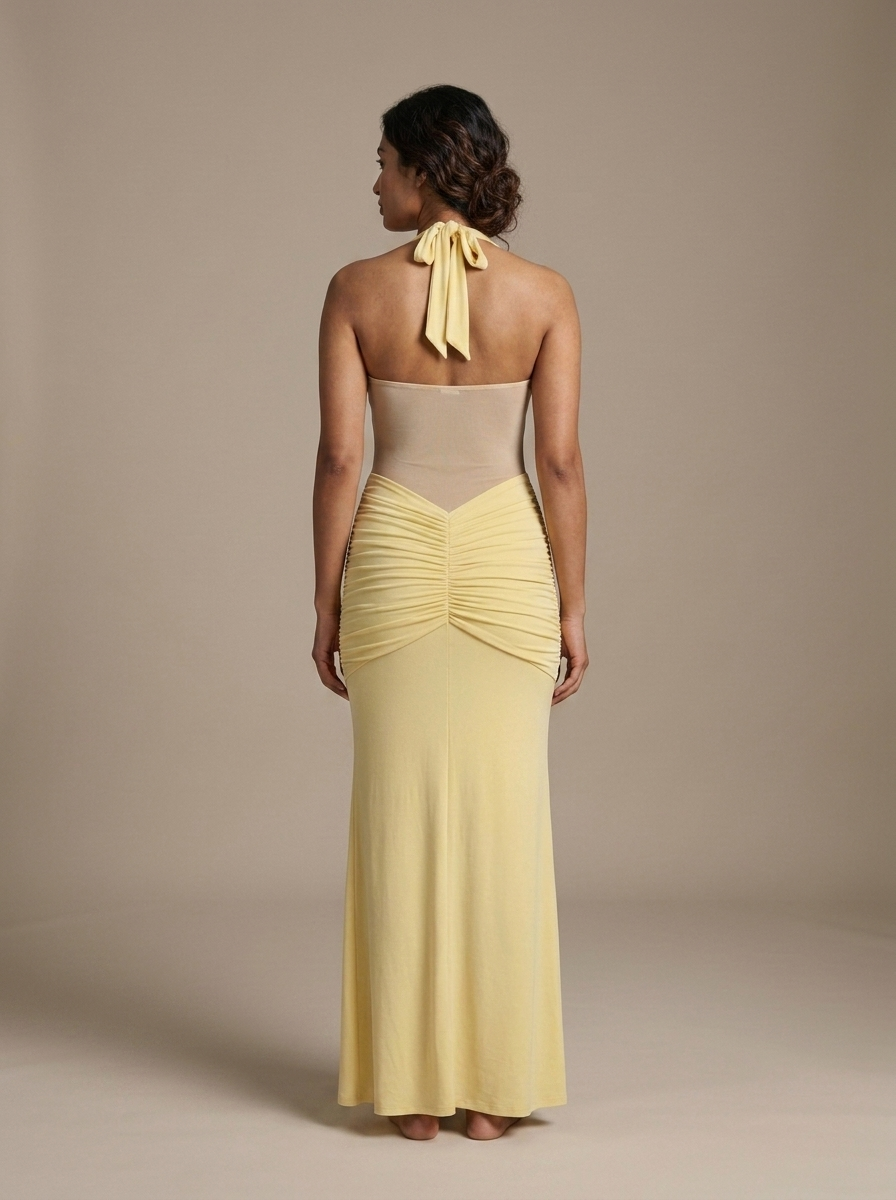 Yellow Halter Ruched Sheer Maxi Dress worn by a model, back view